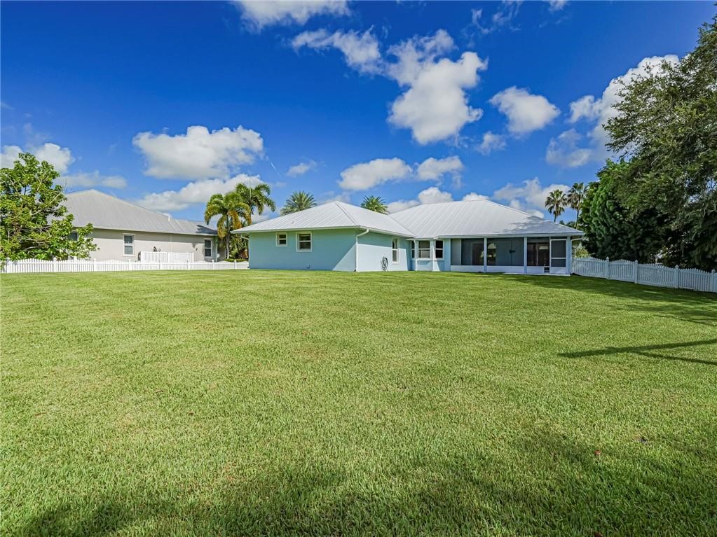 6445 55th Square Vero Beach, FL 32967 - Photo 33 of 36 a view of a house with a big yard