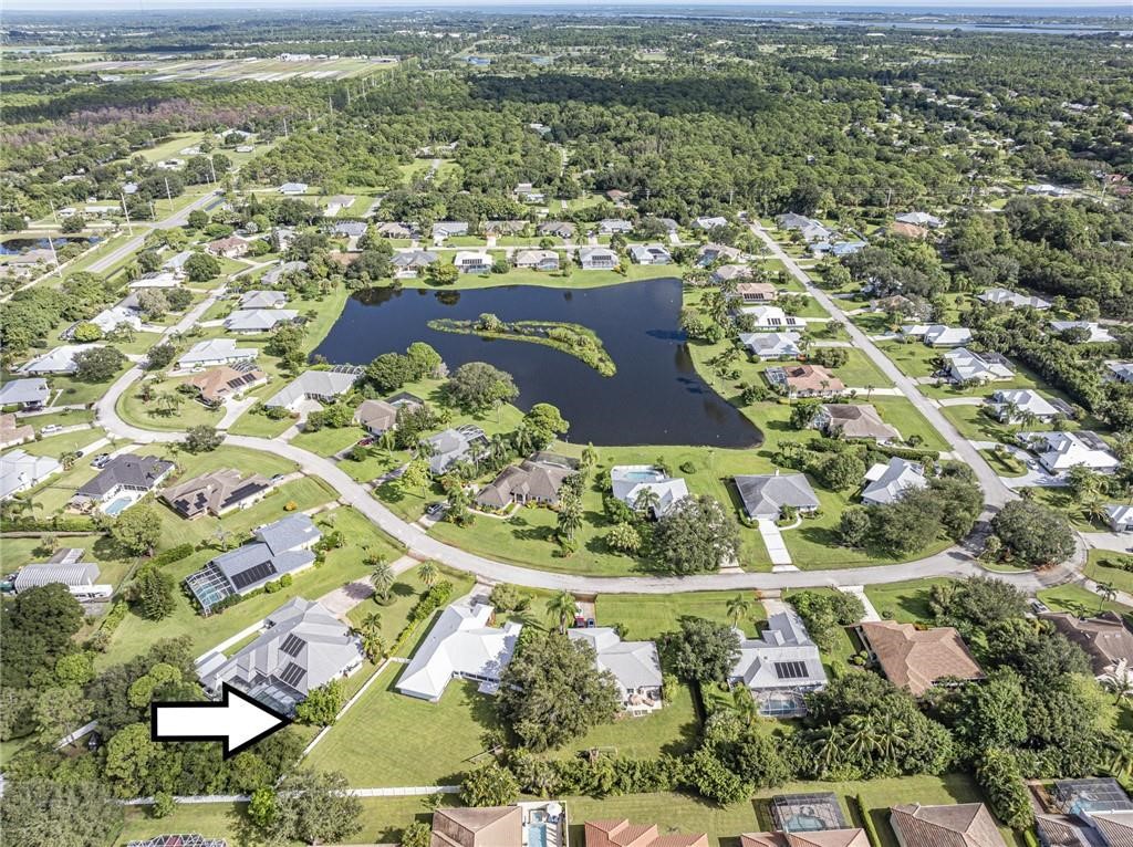 6445 55th Square Vero Beach, FL 32967 - Photo 36 of 36 an aerial view of residential houses with outdoor space