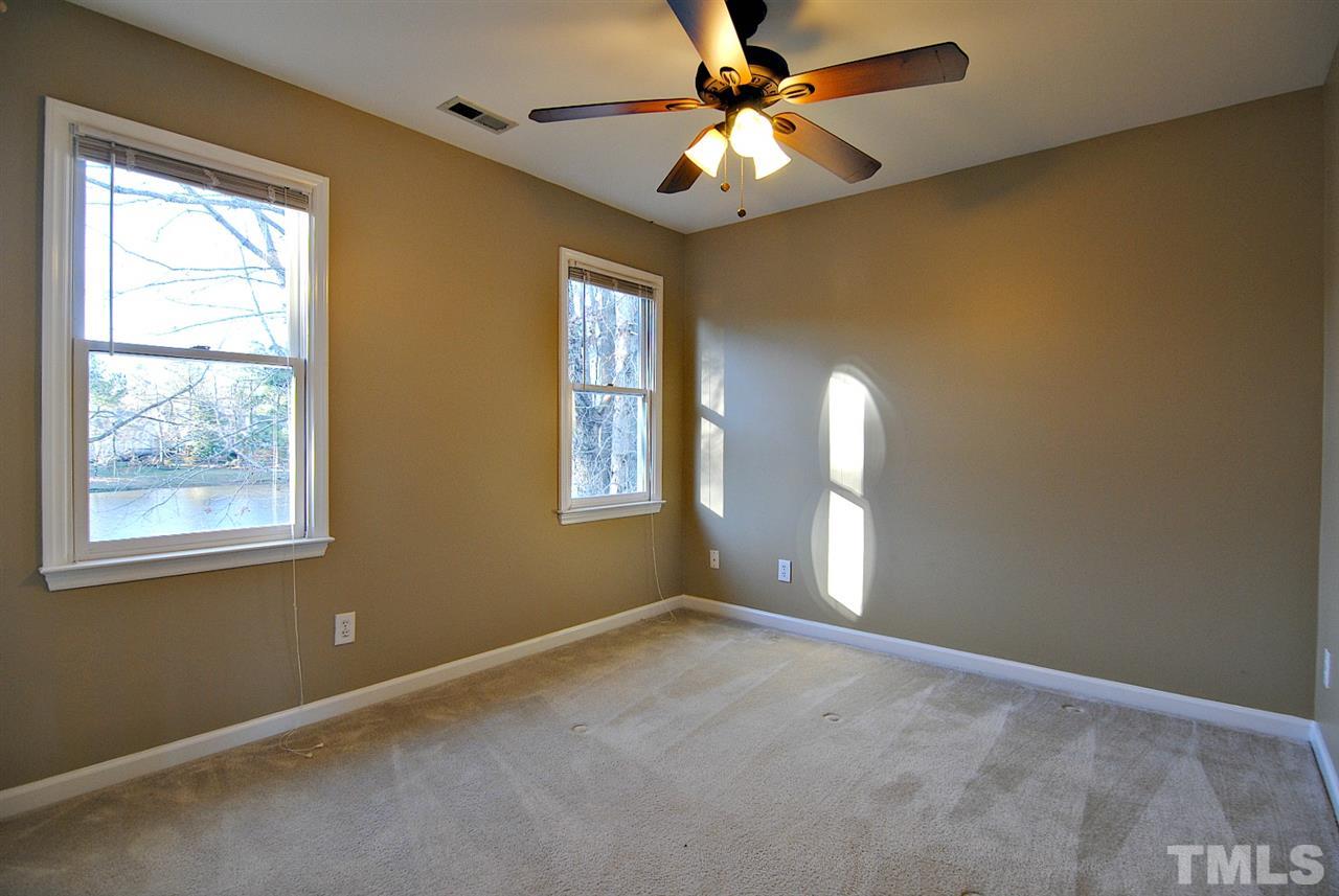 2216 Dahlgreen Road Raleigh, NC 27615 - Photo 17 of 22 an empty room with windows and fan