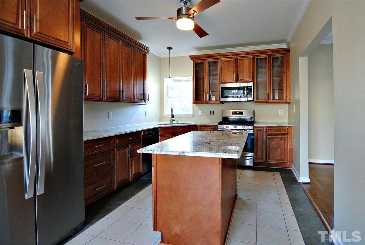 2216 Dahlgreen Road Raleigh, NC 27615 - Photo 9 of 22 a kitchen with stainless steel appliances granite countertop a refrigerator a sink dishwasher a stove and a refrigerator