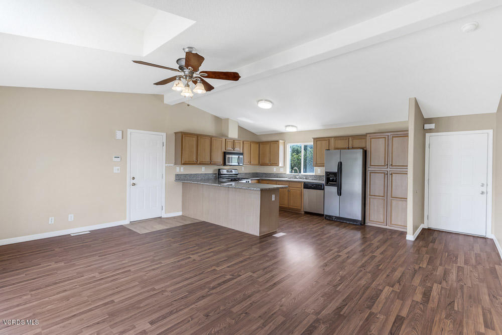 15535 LaPeyre Road Moorpark, CA 93021 - Photo 16 of 34 a view of kitchen with cabinets appliances wooden floor and window