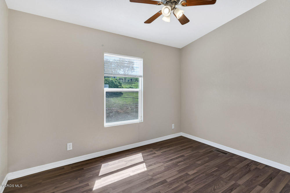 15535 LaPeyre Road Moorpark, CA 93021 - Photo 17 of 34 wooden floor in an empty room with a window