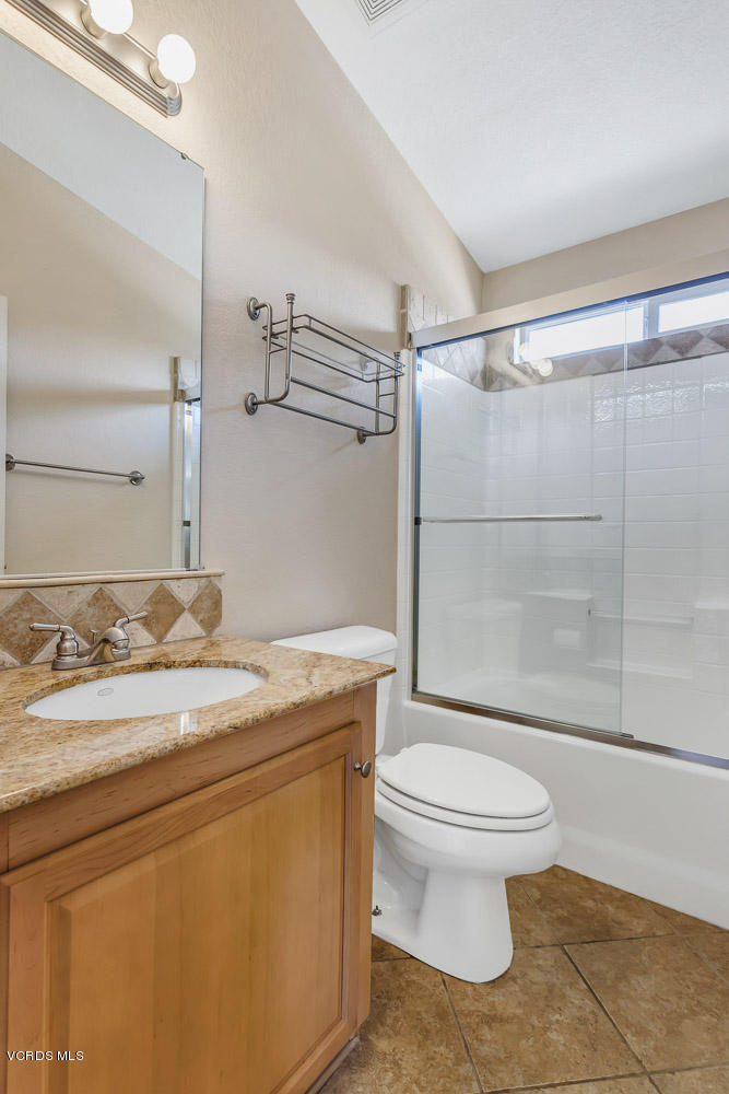 15535 LaPeyre Road Moorpark, CA 93021 - Photo 18 of 34 a bathroom with a granite countertop sink toilet and shower