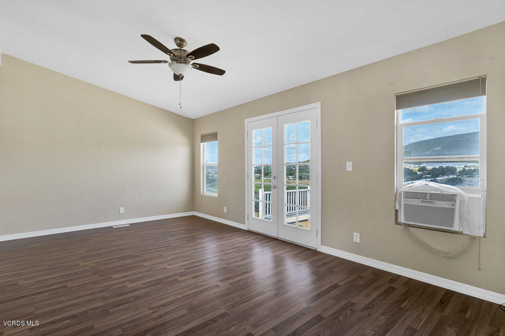 15535 LaPeyre Road Moorpark, CA 93021 - Photo 19 of 34 a view of a livingroom with wooden floor and a ceiling fan