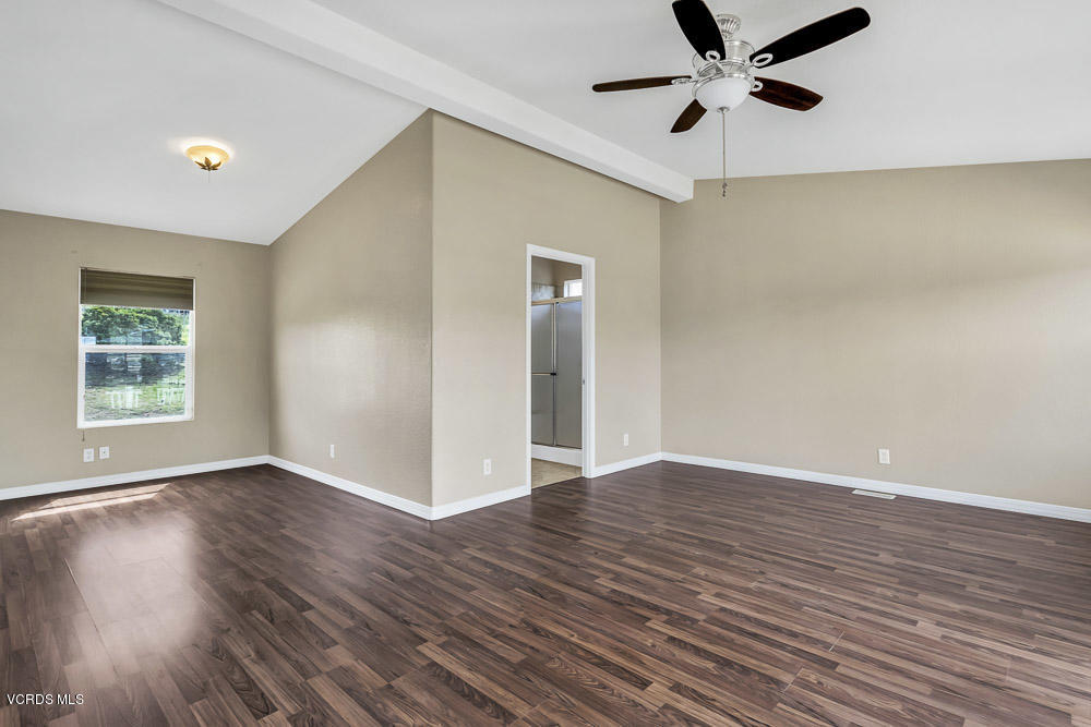 15535 LaPeyre Road Moorpark, CA 93021 - Photo 21 of 34 a view of an empty room with wooden floor and a window