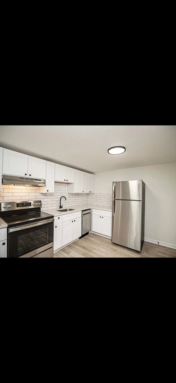 103 South Policy Street, Unit 10 Salem, NH 03079 - Photo 4 of 6 a view of kitchen with stainless steel appliances