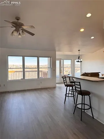 a view of a livingroom with furniture window and wooden floor