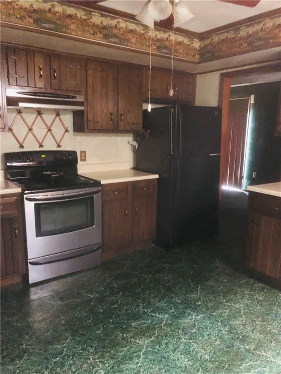 735 State Rte 2003 Rural Valley, PA 16249 - Photo 5 of 14 a kitchen with granite countertop a stove and a refrigerator