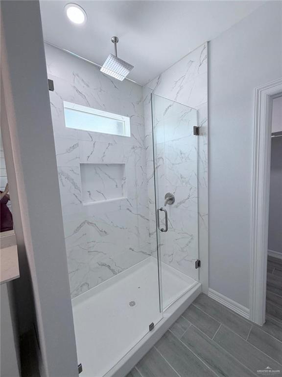 1724 Clinton Street Harlingen, TX 78550 - Photo 11 of 23 a bathroom with a glass shower door