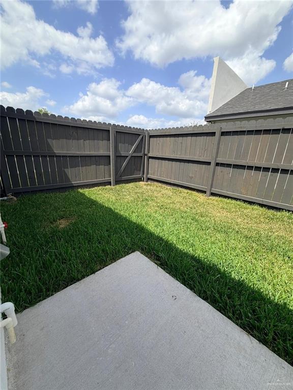 1724 Clinton Street Harlingen, TX 78550 - Photo 18 of 23 a view of a backyard with wooden fence
