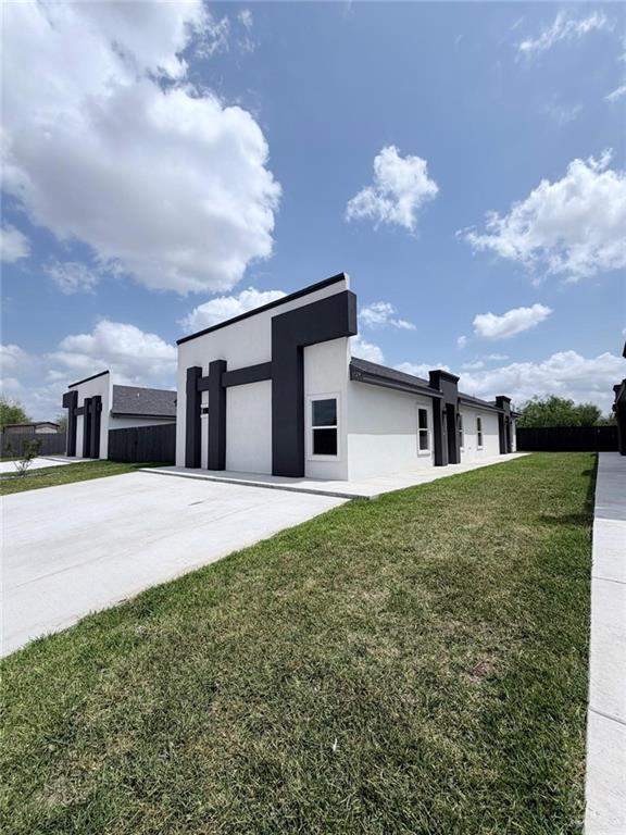 1724 Clinton Street Harlingen, TX 78550 - Photo 2 of 23 a house view with a garden space