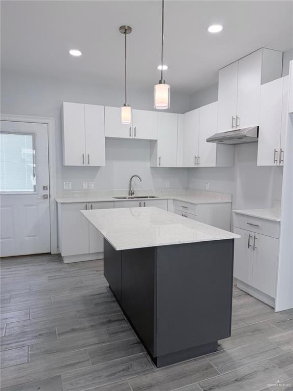 1724 Clinton Street Harlingen, TX 78550 - Photo 4 of 23 a kitchen with kitchen island a sink stainless steel appliances and cabinets