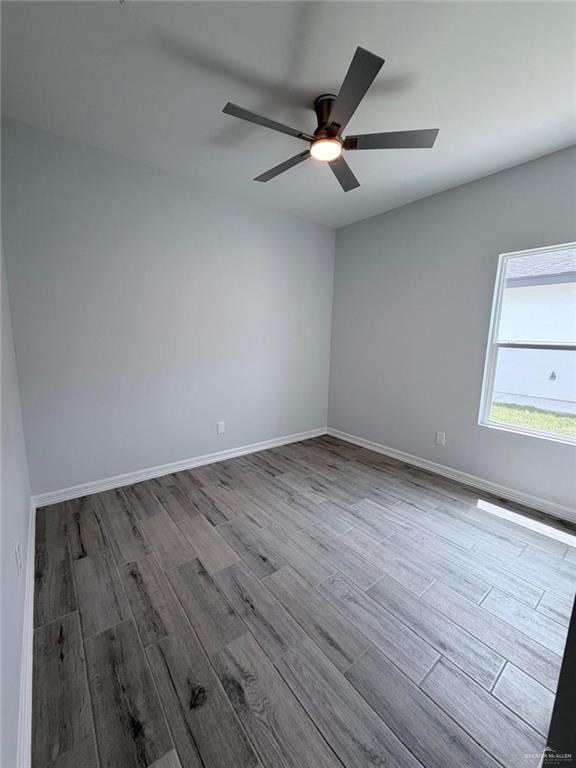 1724 Clinton Street Harlingen, TX 78550 - Photo 5 of 23 wooden floor in an empty room