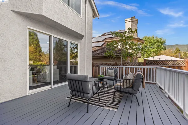 a view of balcony with furniture
