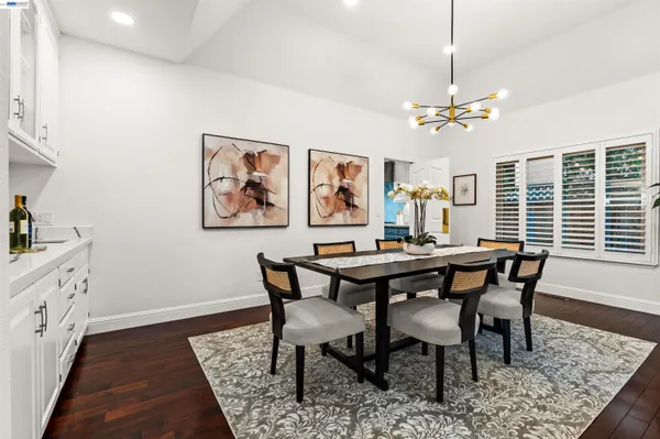 a view of a dining room with furniture window and wooden floor