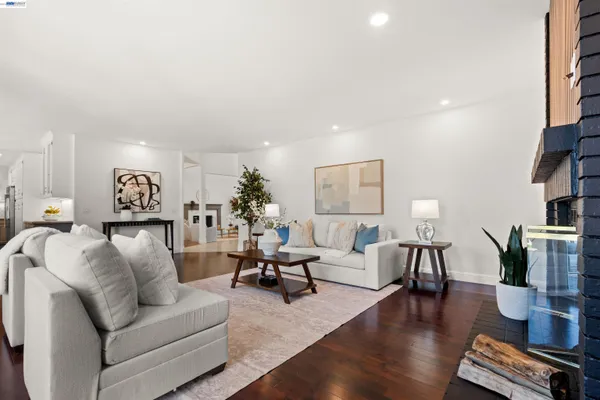 a living room with furniture or couch and a potted plant