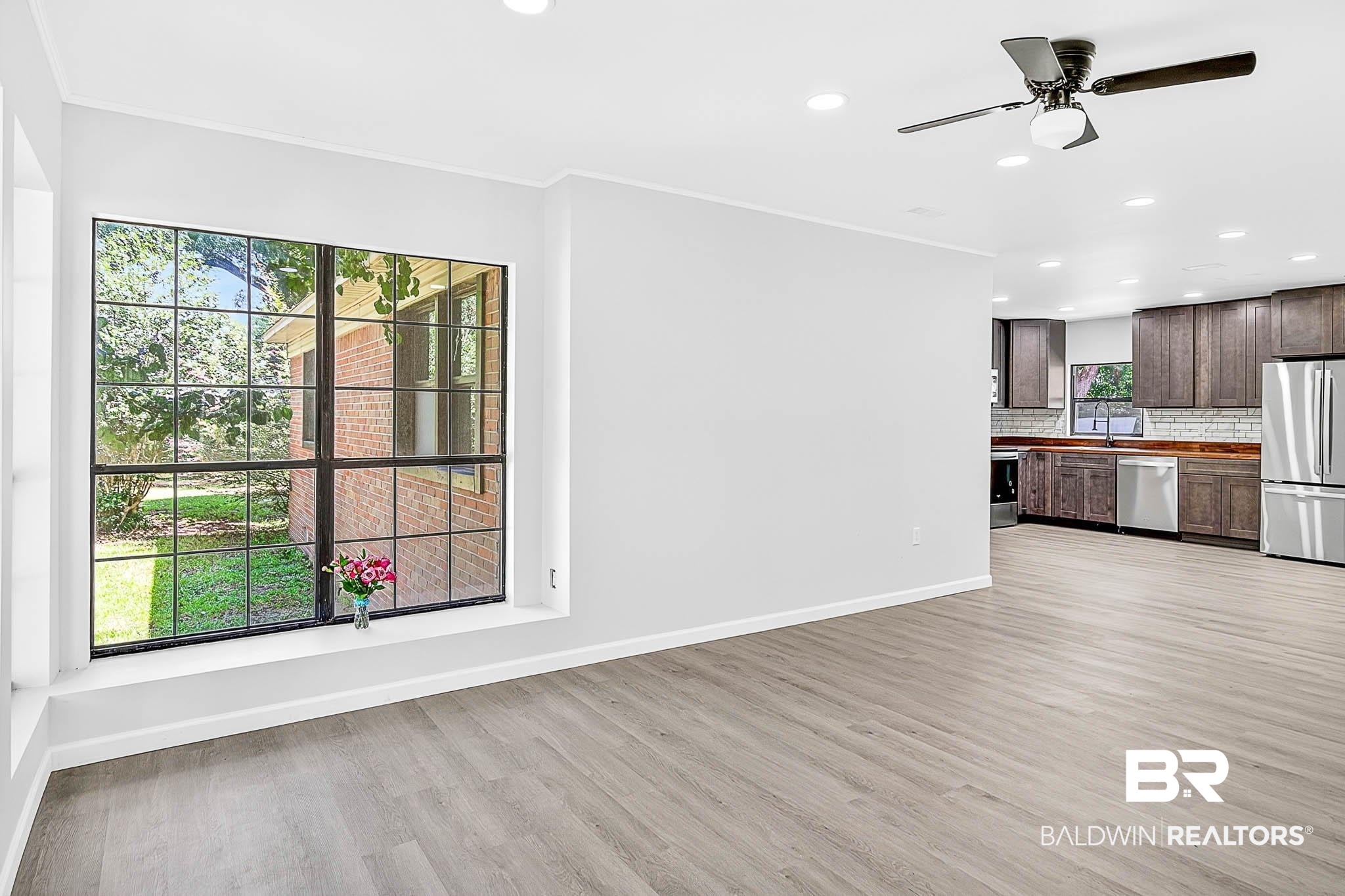 101 Terry Avenue Brewton, AL 36426 - Photo 28 of 48 Unfurnished living room featuring light wood-style flooring, crown molding, recessed lighting, and a ceiling fan