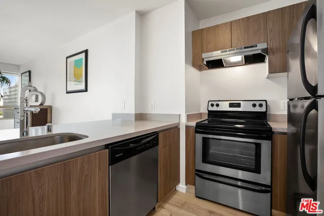 an empty room with wooden floor and closet