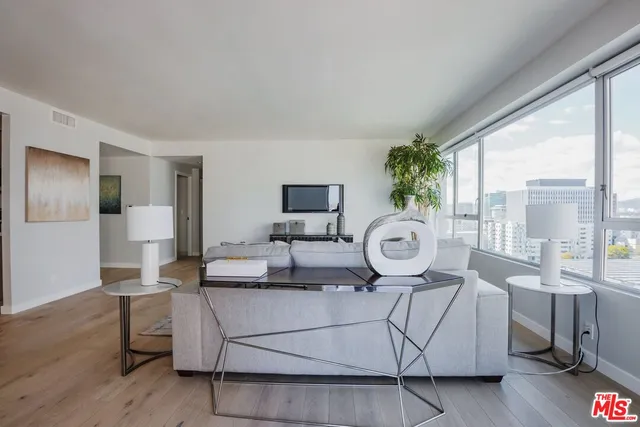 a living room with furniture and a table