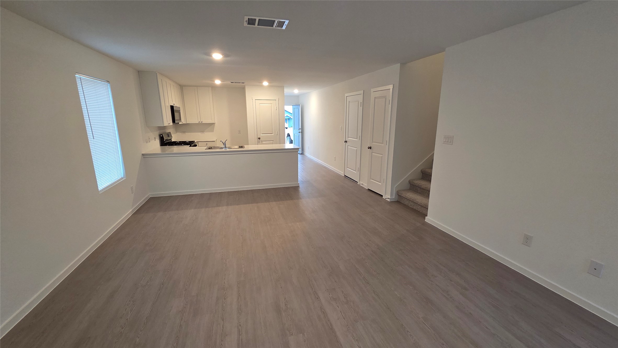 110 Canadian Cove Kyle, TX 78640 - Photo 2 of 20 a view of kitchen with wooden floor