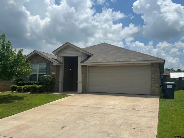 a front view of house with yard