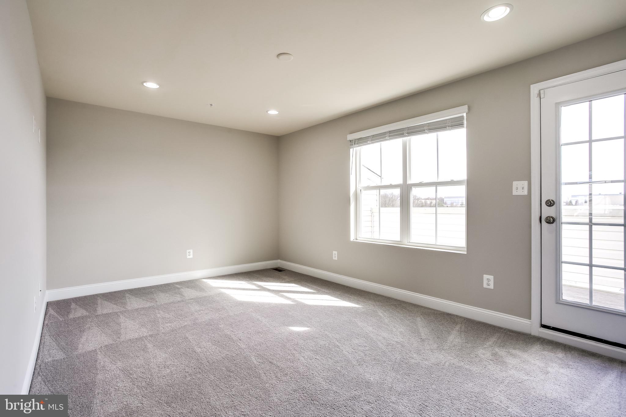 7034 Rackham Way Hanover, MD 21076 - Photo 31 of 42 Recreation Room w/ Walk out Rooftop Deck.