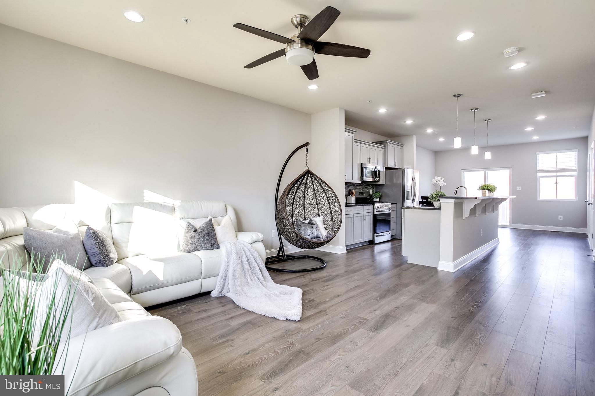 7034 Rackham Way Hanover, MD 21076 - Photo 5 of 42 Living Area | Ceiling Fan | Like NEW Flooring.