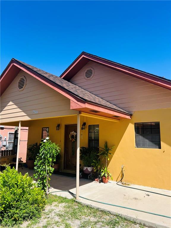 2349 Elaine Street Roma, TX 78584 - Photo 16 of 16 a view of a blue house with front door