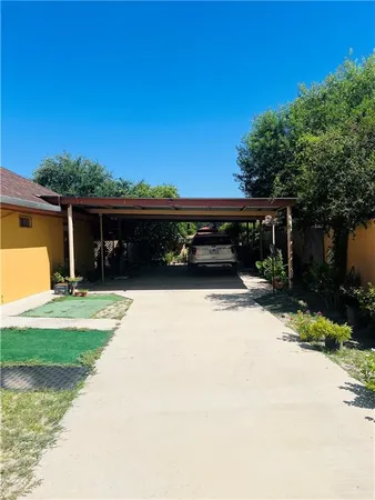 a view of yard with patio