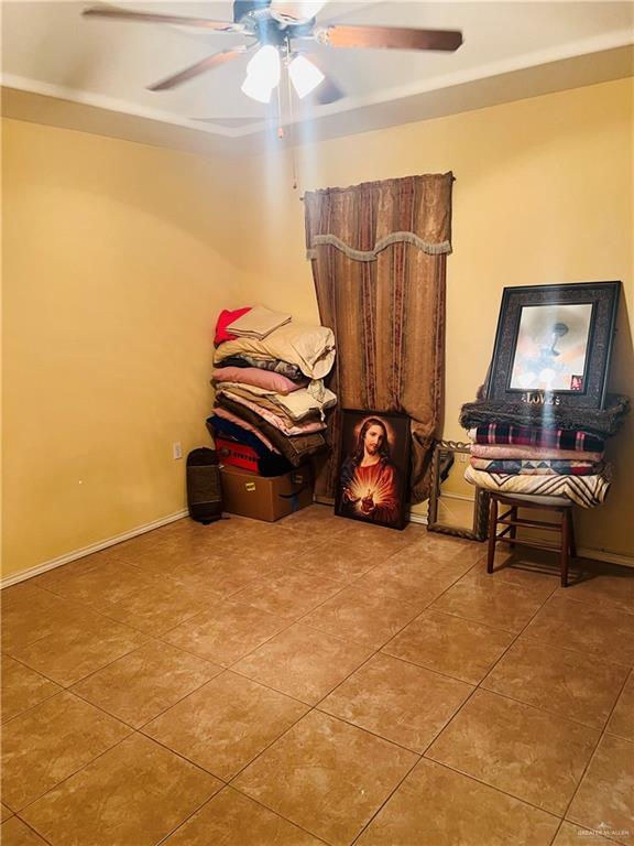 2349 Elaine Street Roma, TX 78584 - Photo 8 of 16 a room with furniture and a flat screen tv