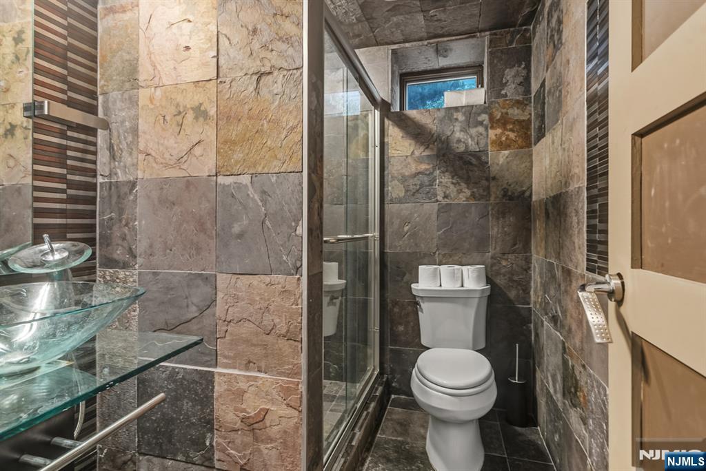 760 Undercliff Avenue Edgewater, NJ 07020 - Photo 39 of 48 a bathroom with a toilet and a shower