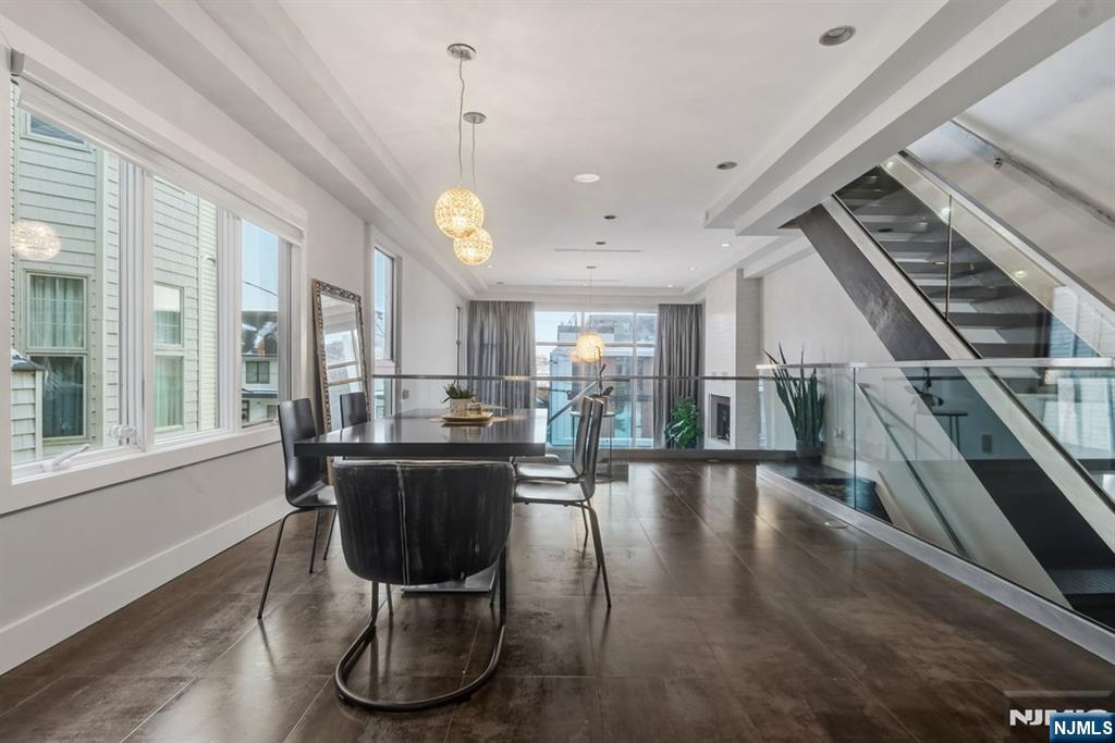 760 Undercliff Avenue Edgewater, NJ 07020 - Photo 42 of 48 a view of a dining room with furniture window and wooden floor