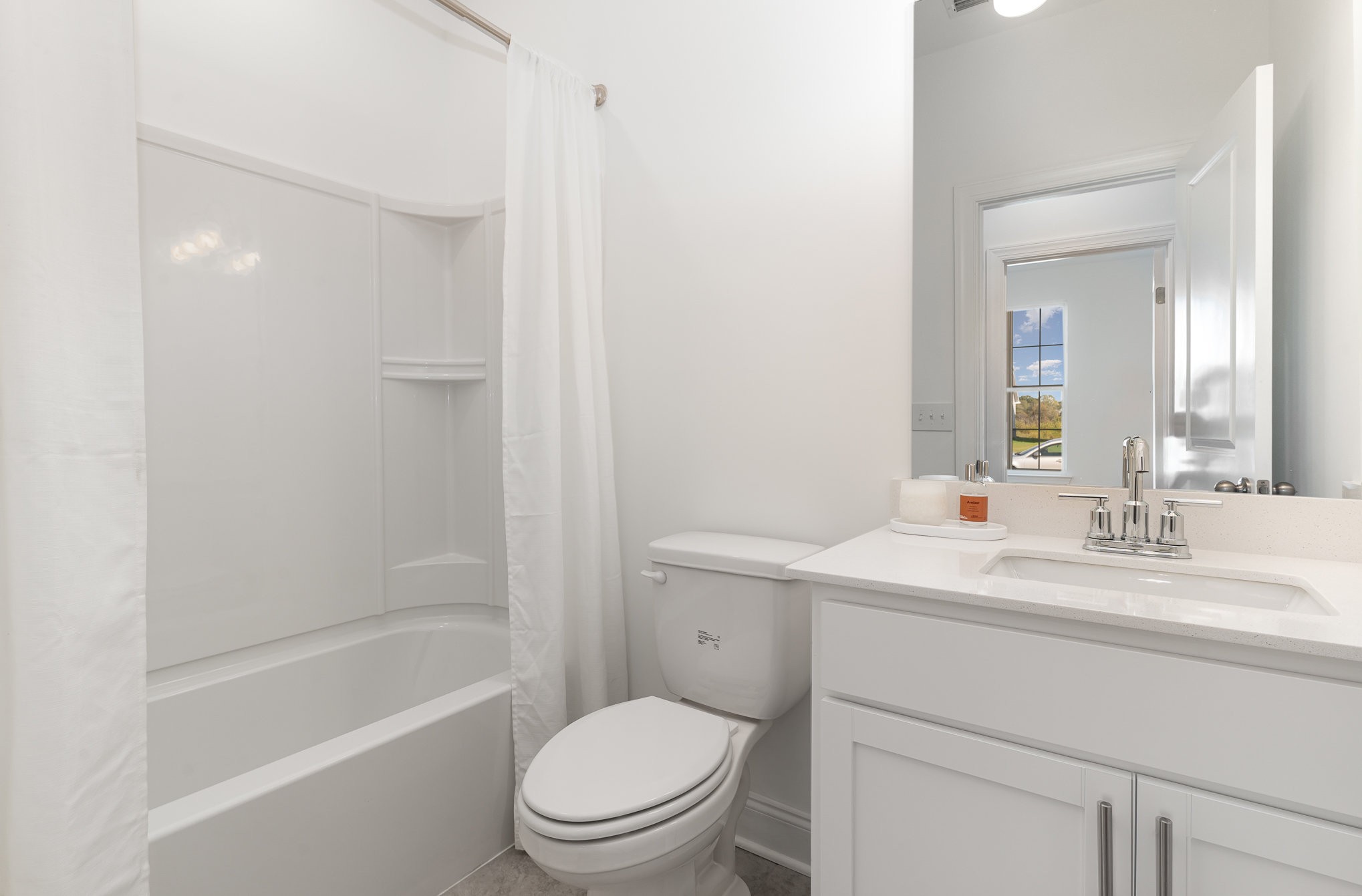 3114 Arbor Valley Rd Spring Hill, Unit C7G Spring Hill, TN 37174 - Photo 27 of 36 a bathroom with a toilet a sink a mirror a bathtub and shower