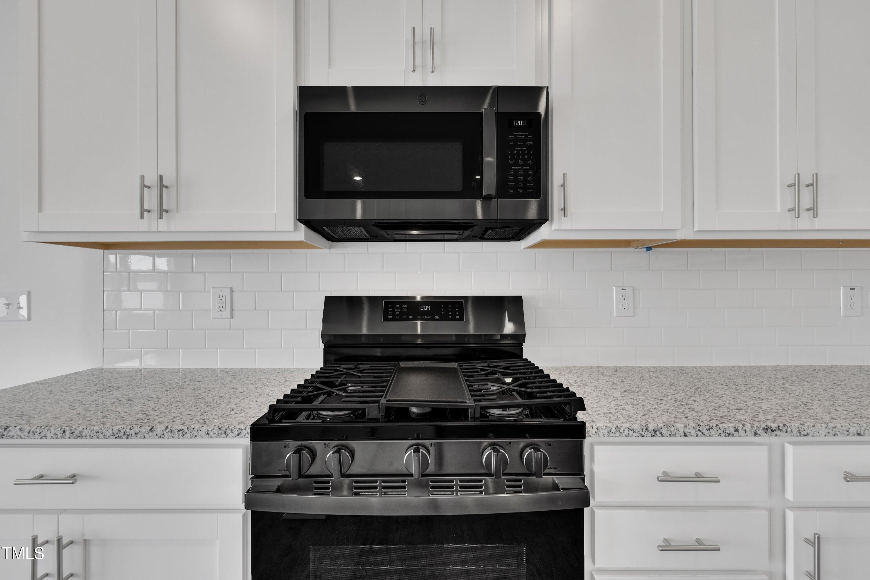 281 Hank Way Angier, NC 27501 - Photo 13 of 39 a stove top oven sitting inside of a kitchen