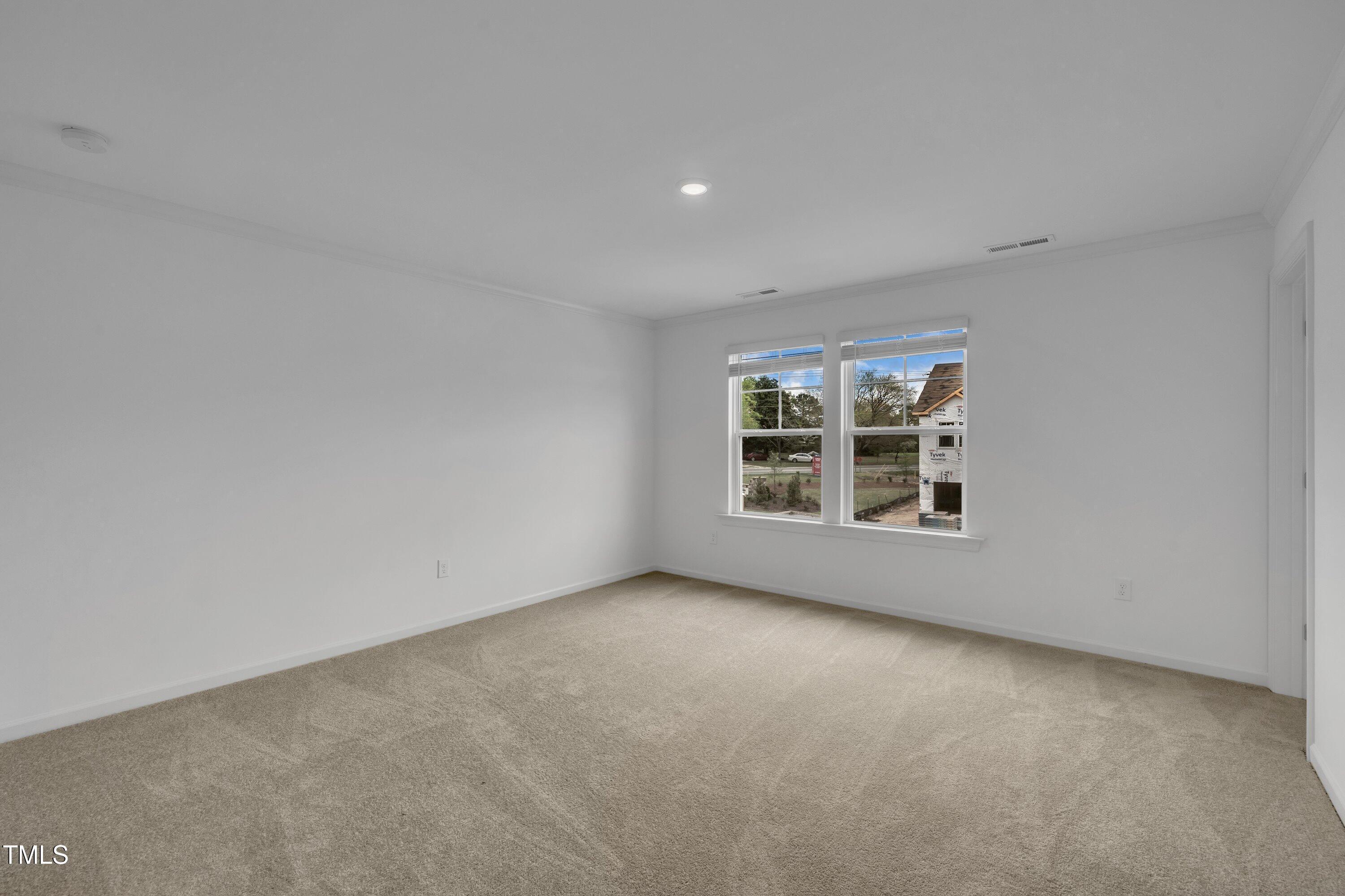 281 Hank Way Angier, NC 27501 - Photo 20 of 39 a view of an empty room with a window
