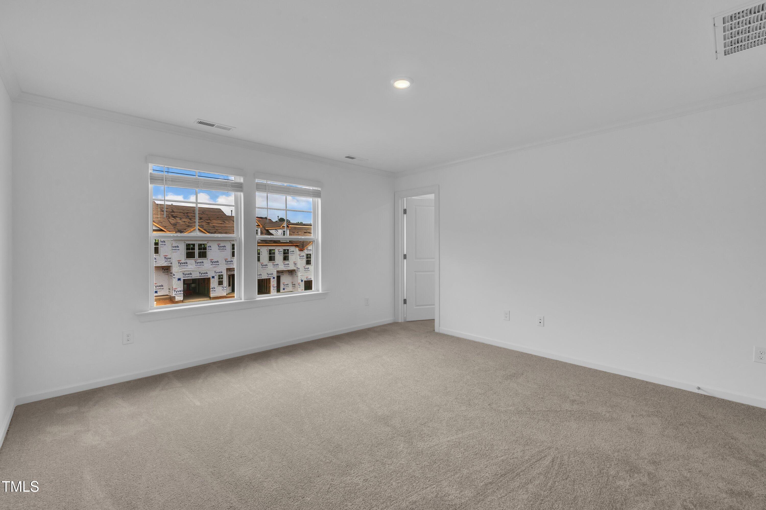 281 Hank Way Angier, NC 27501 - Photo 24 of 39 a view of an empty room with a window