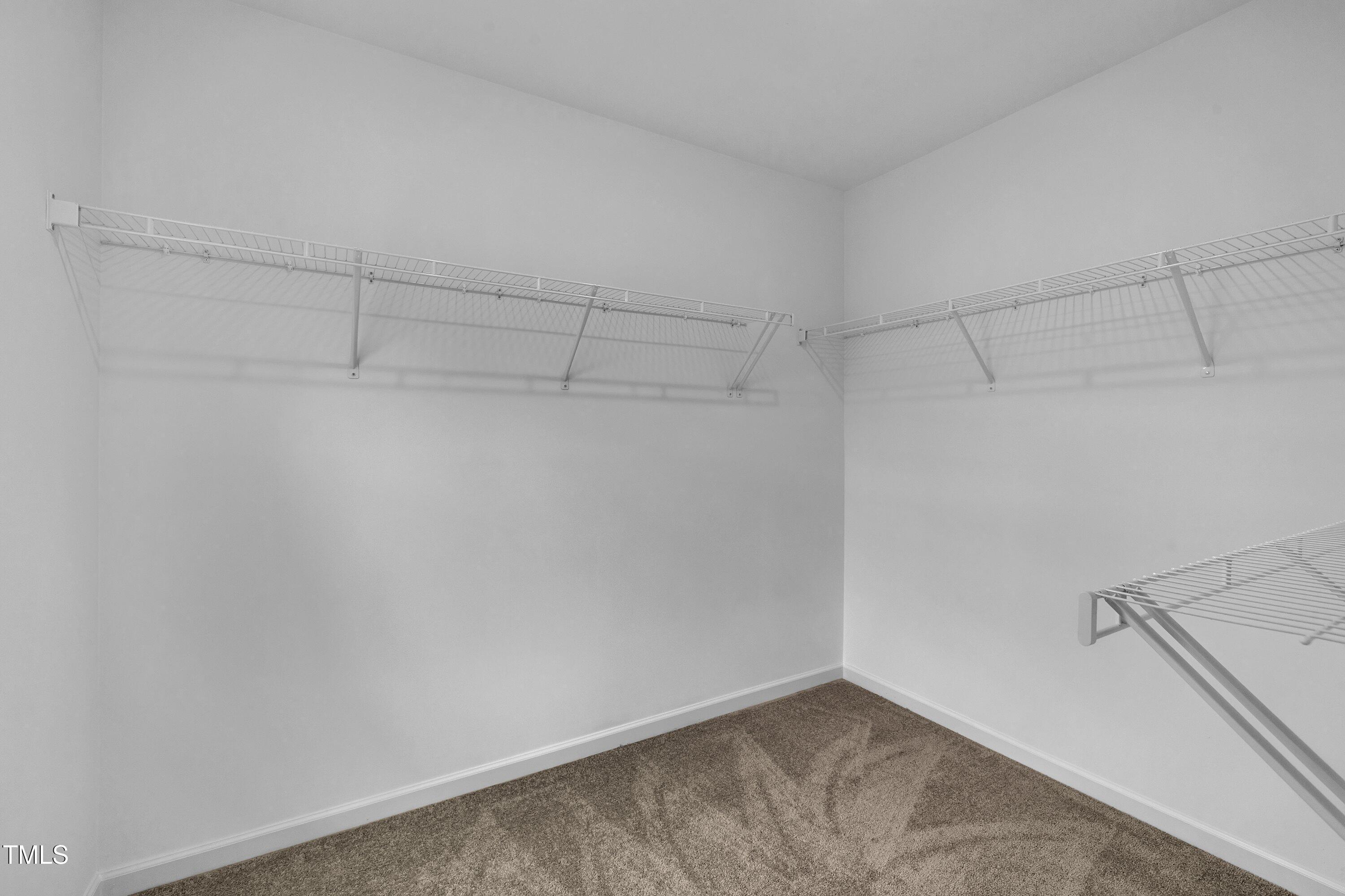281 Hank Way Angier, NC 27501 - Photo 28 of 39 a view of a room with racks on the wall