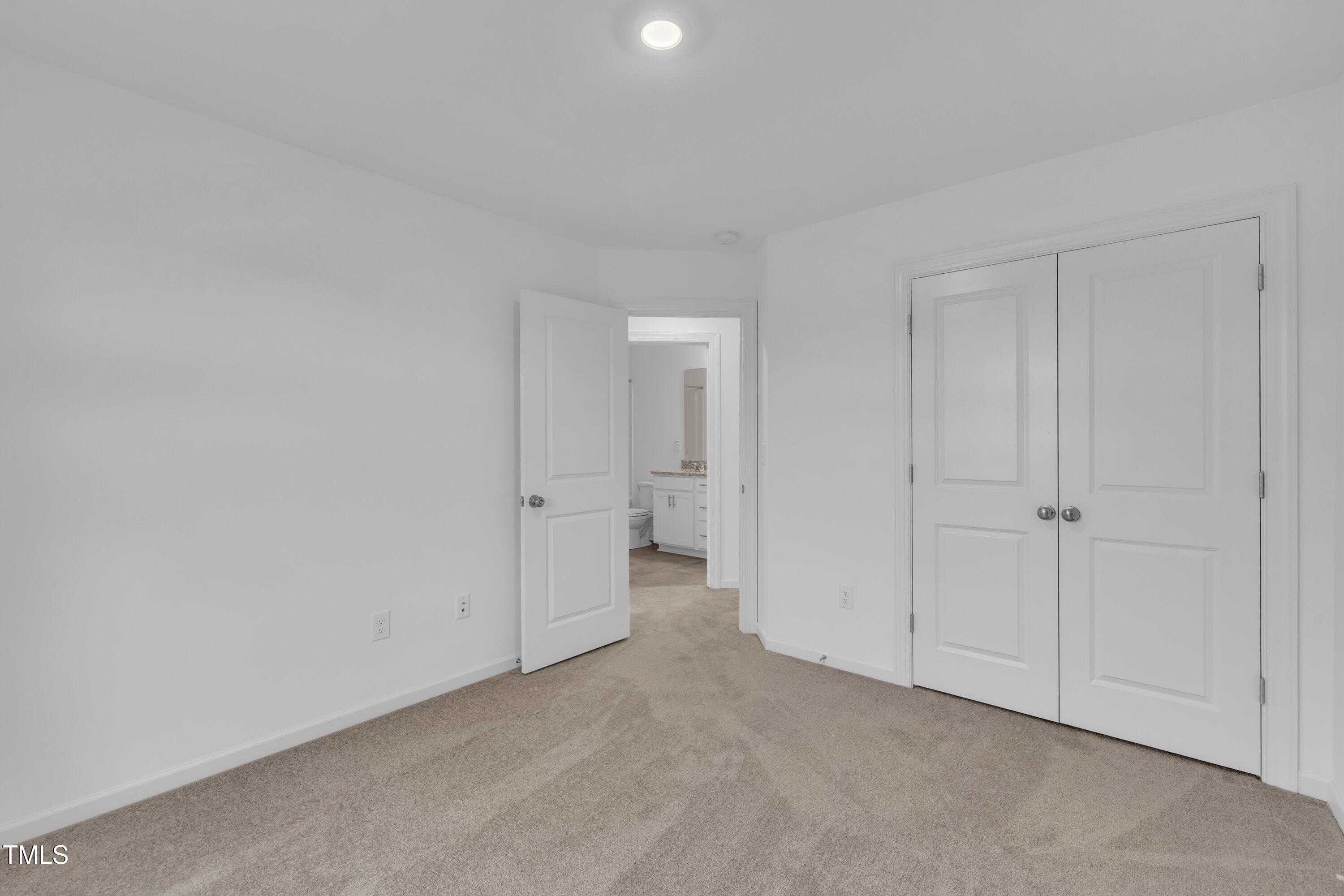 281 Hank Way Angier, NC 27501 - Photo 35 of 39 a view of an empty room and a bathroom
