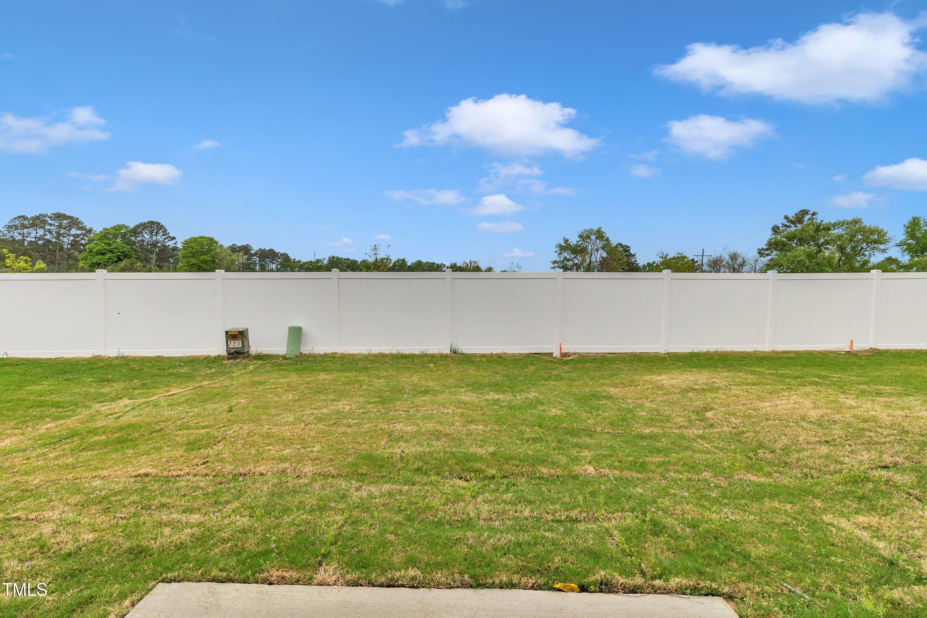 281 Hank Way Angier, NC 27501 - Photo 36 of 39 a view of a lake from a yard