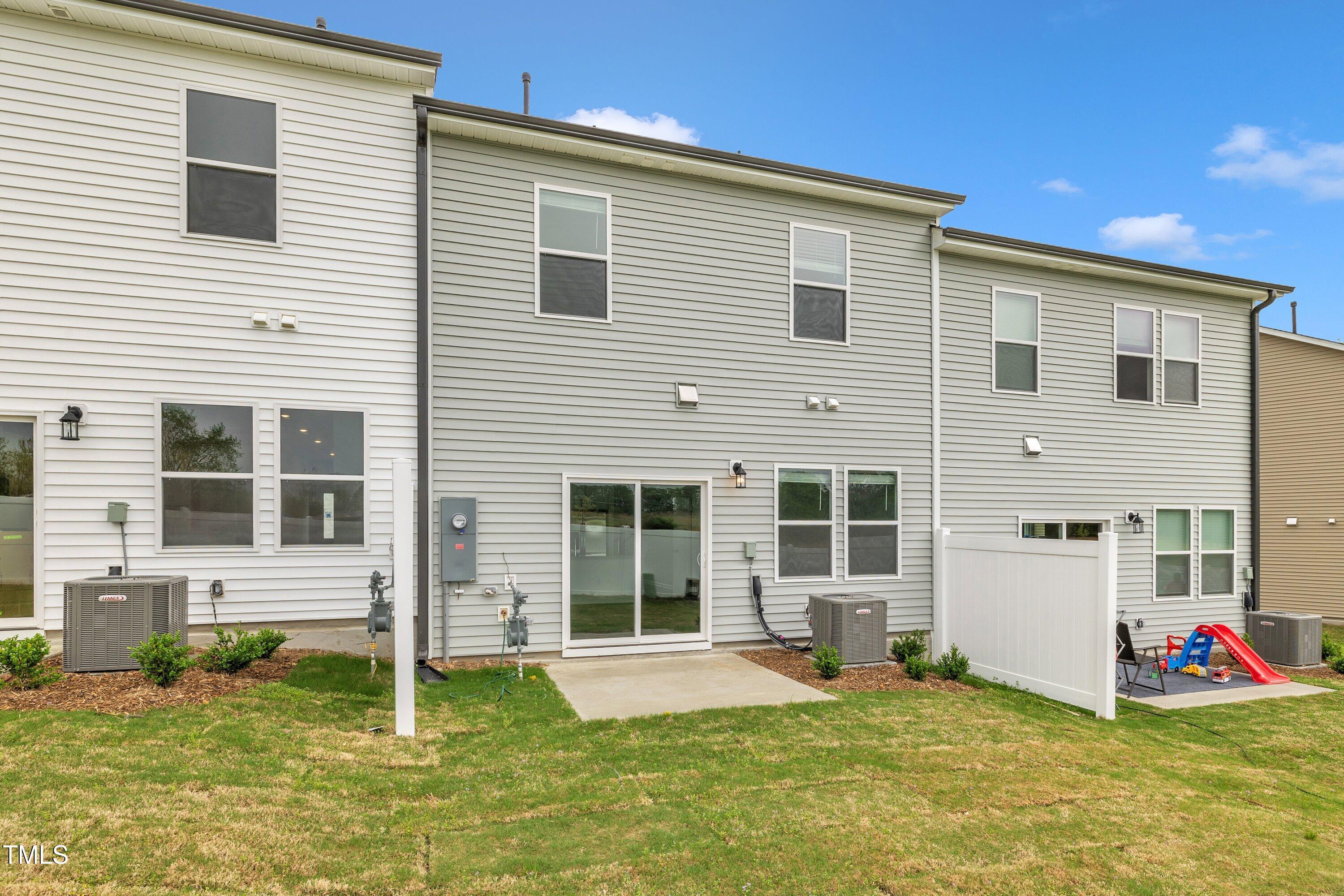 281 Hank Way Angier, NC 27501 - Photo 37 of 39 a view of a house with a yard and sitting area