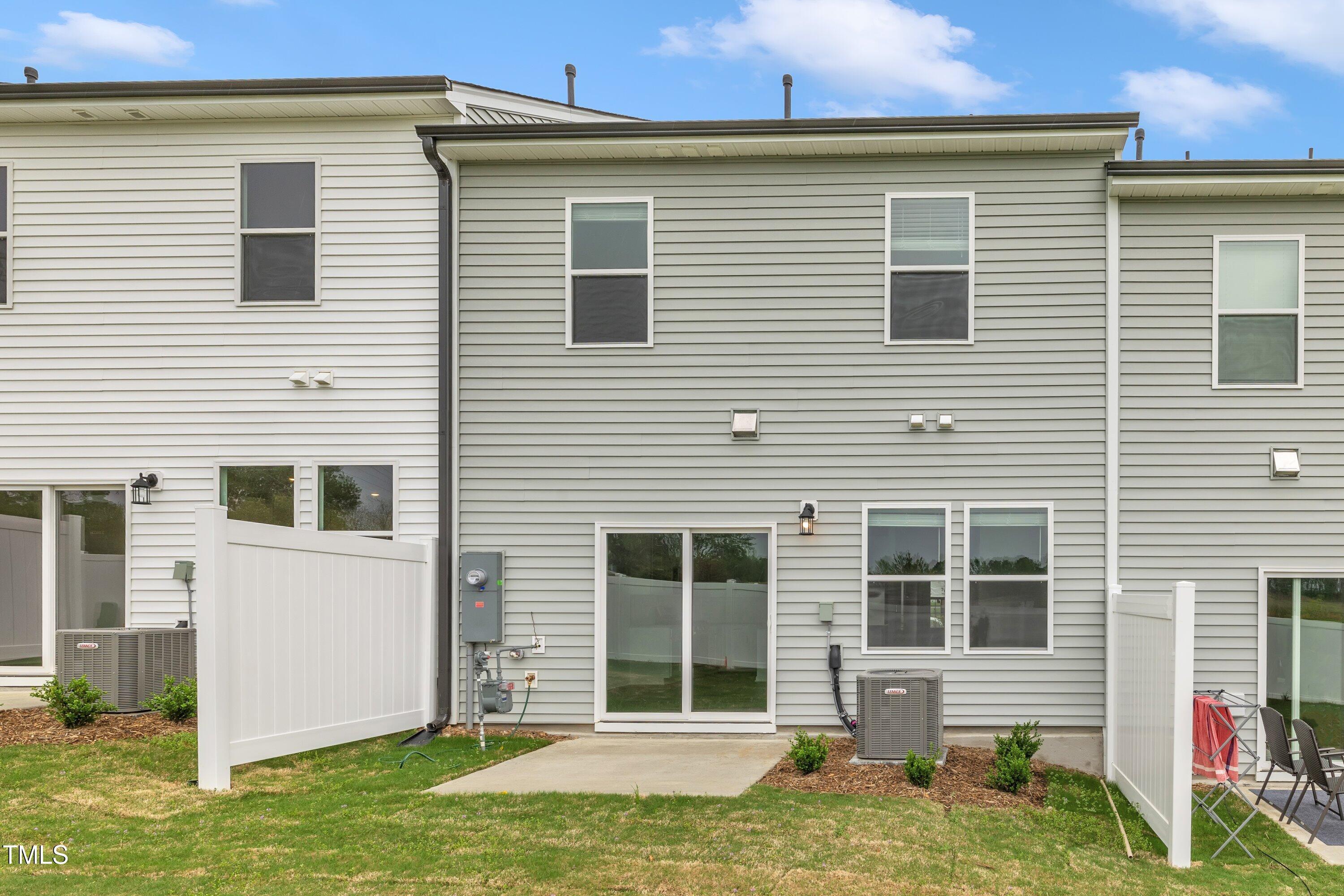 281 Hank Way Angier, NC 27501 - Photo 38 of 39 a view of a house with a yard