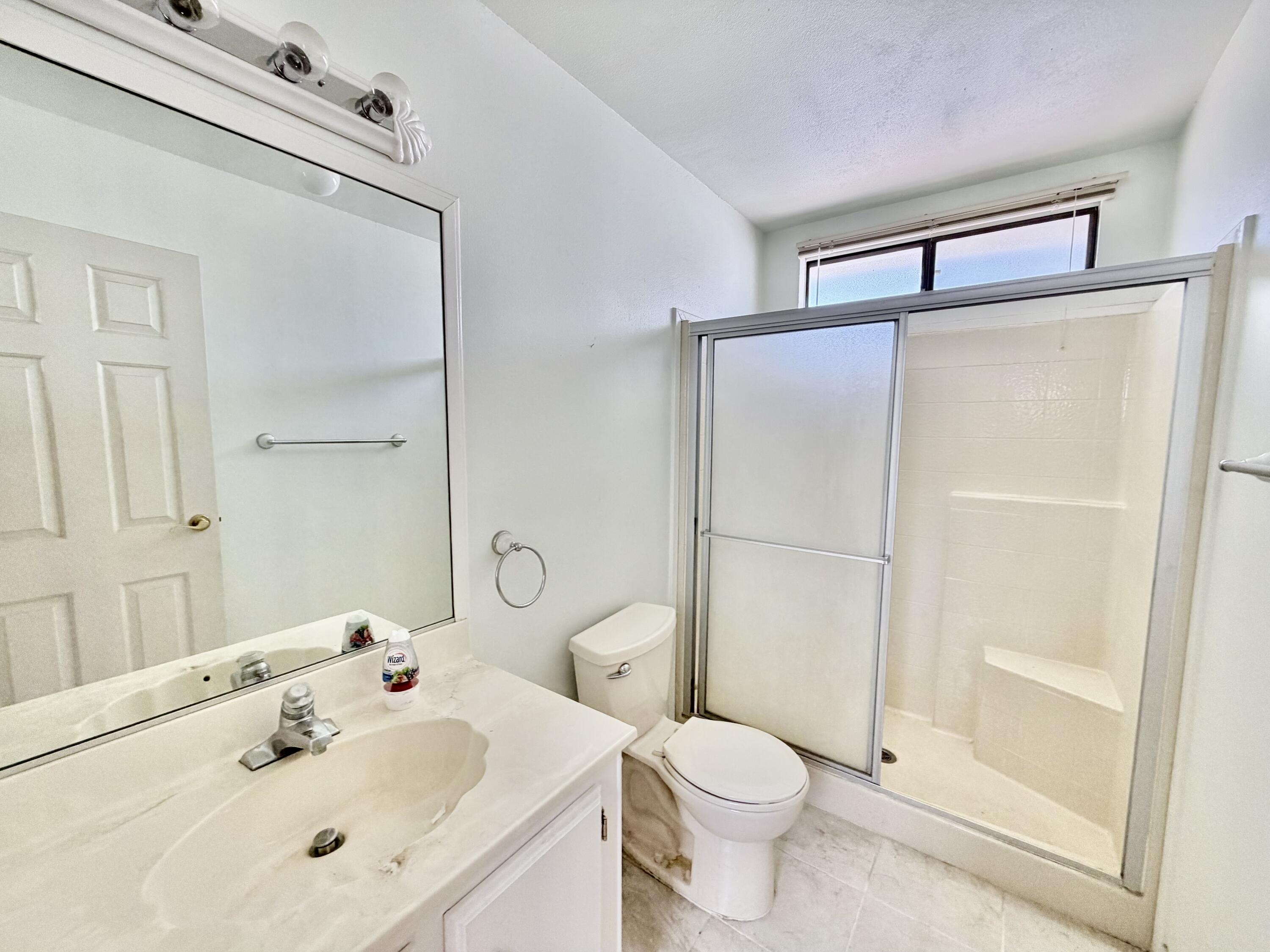 74361 Angel Camp Road Palm Desert, CA 92260 - Photo 11 of 12 a bathroom with a sink toilet and shower