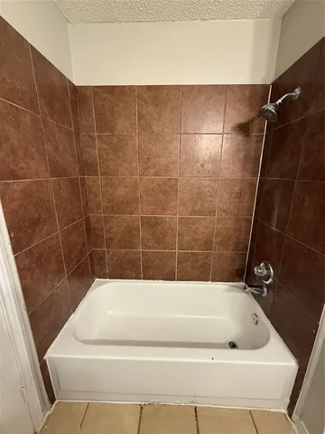 a bathroom with a bath tub