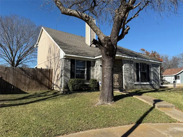 a view of house with yard