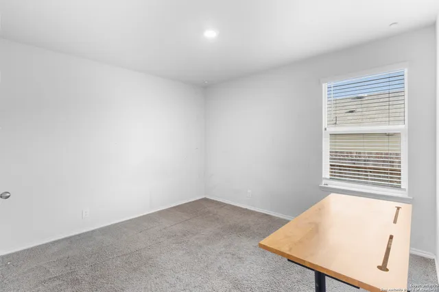 a view of a room that has a window in it