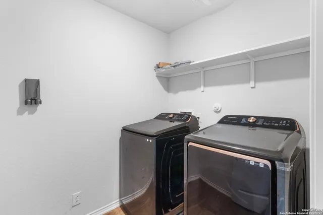 a utility room with dryer and washer