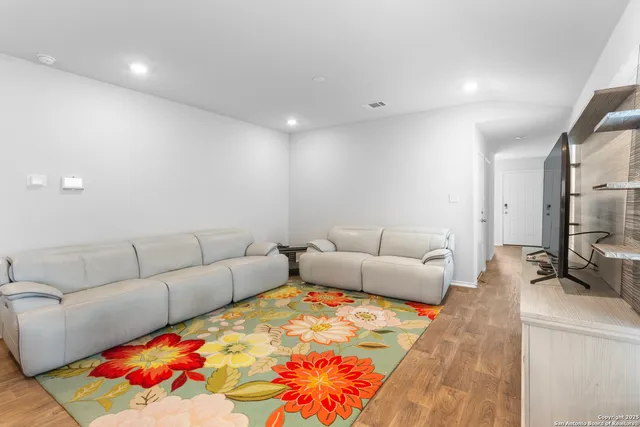 a living room with furniture and a couch