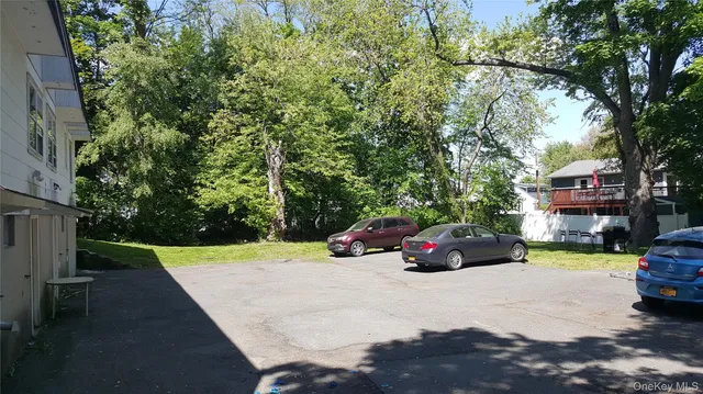 a view of street with parked cars