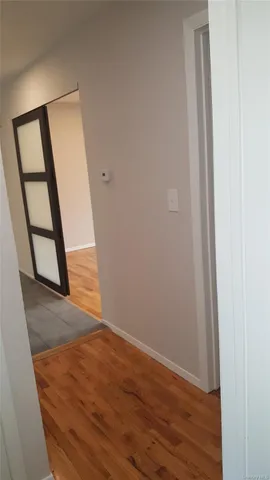 a view of entryway with wooden floor