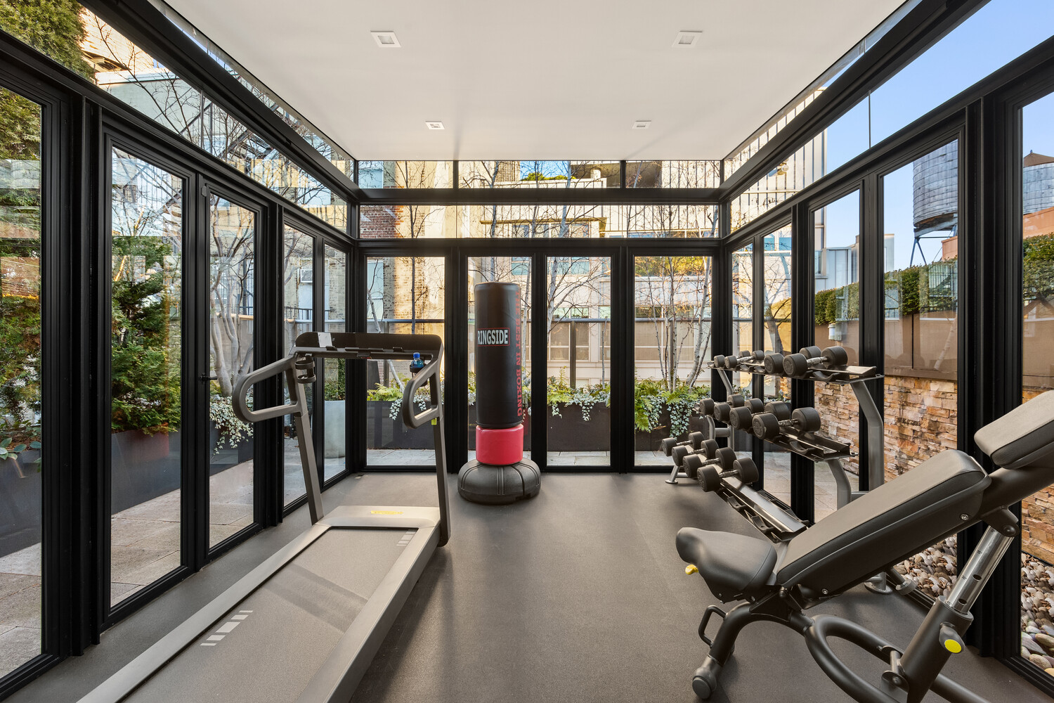 459 West Broadway, Unit PHS Manhattan, NY 10012 - Photo 12 of 17 a view of a room with gym equipment